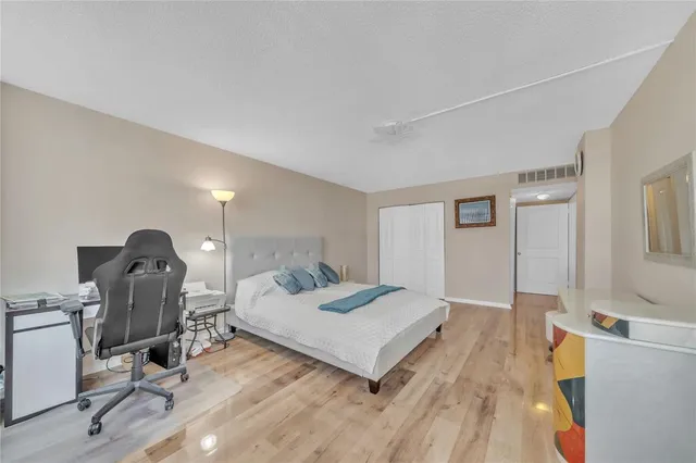 a bedroom with a bed and a table in it