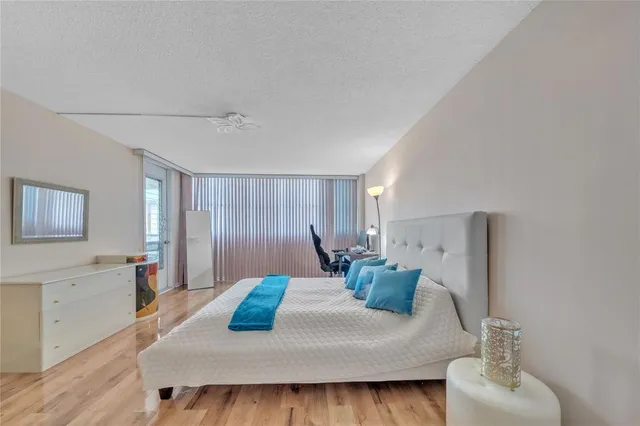 a bed room with a bed window and a couch