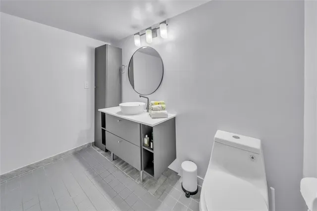 a bathroom with a sink and mirror
