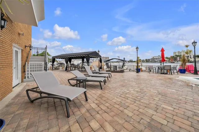 a view of a chairs and table in the patio