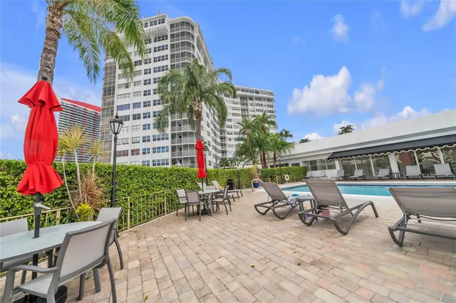a view of a balcony with wooden floor and staircase