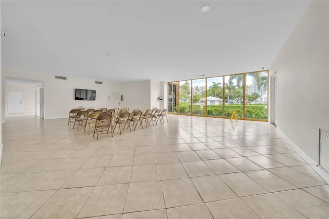 a view of swimming pool with outdoor seating