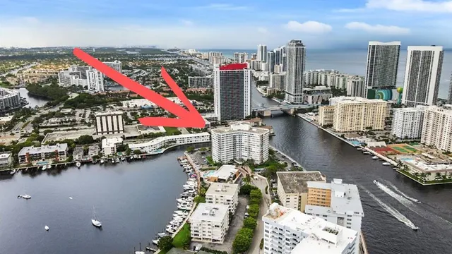 a view of ocean and residential houses with outdoor space