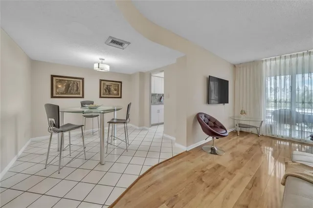 a view of a livingroom with furniture and a flat screen tv