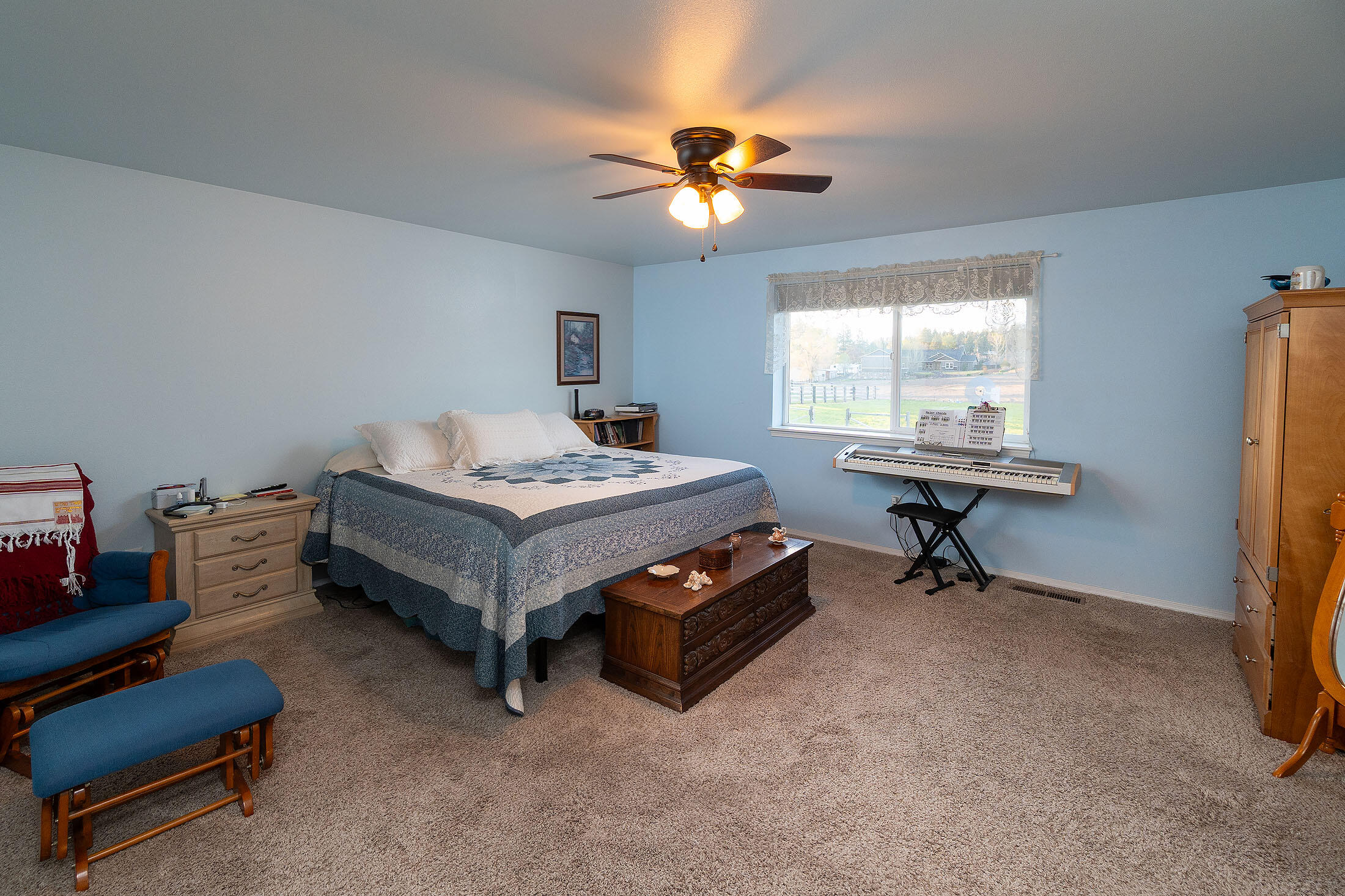 411 Northwest Mc Donald Road Prineville, OR 97754 - Photo 11 of 47 Primary suite is spacious. Ceiling fan, walk-in-closet, and second closet.