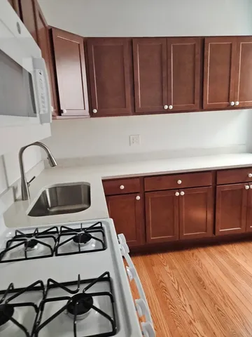 a kitchen with a sink and cabinets