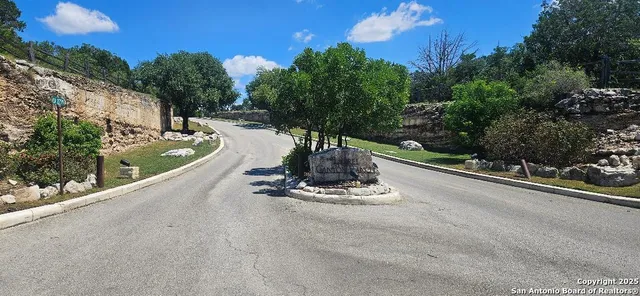 a view of a street with a building in the background