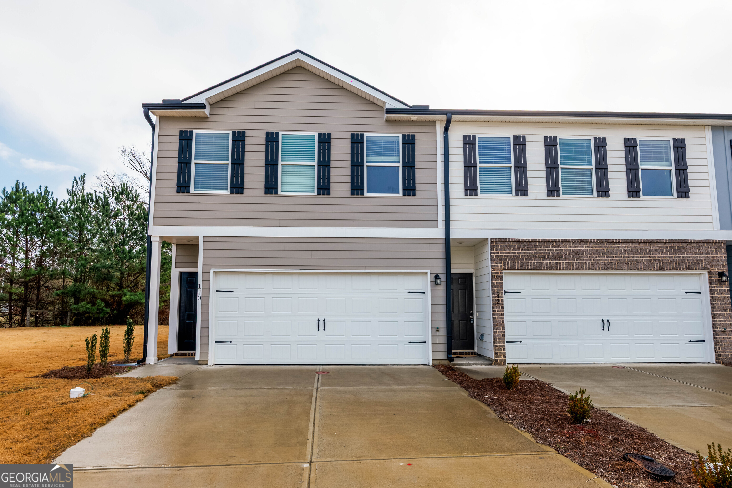 a view of a house with a garage