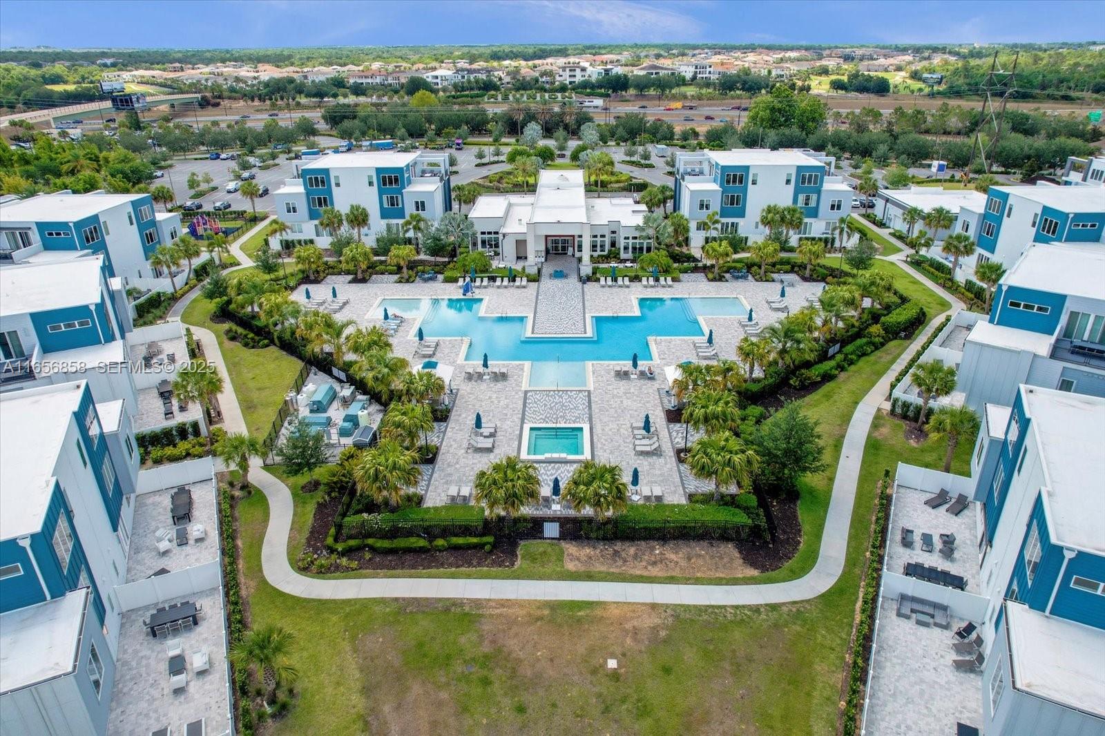 7740 Sandy Ridge Drive, Unit 112 Kissimmee, FL 34747 - Photo 35 of 38 an aerial view of residential houses with outdoor space and swimming pool