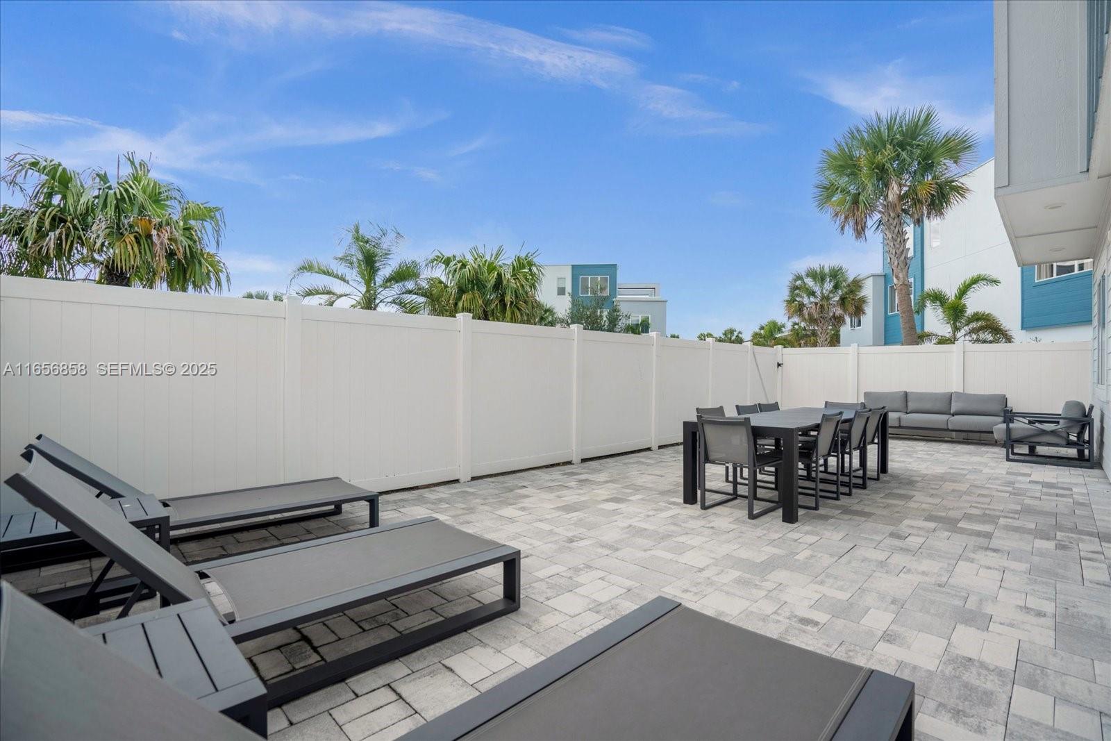 7740 Sandy Ridge Drive, Unit 112 Kissimmee, FL 34747 - Photo 8 of 38 an outdoor sitting area with furniture
