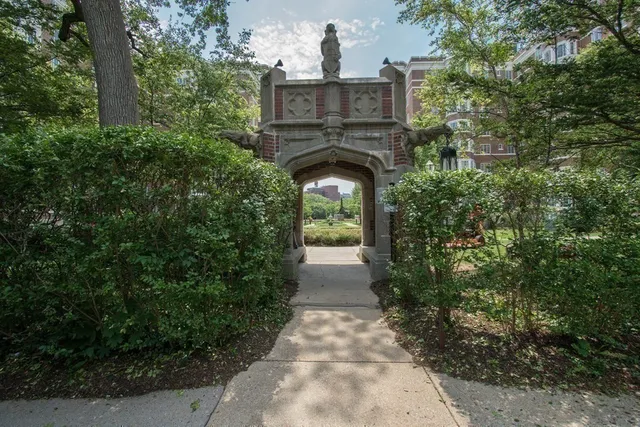 a view of a pathway both side of house