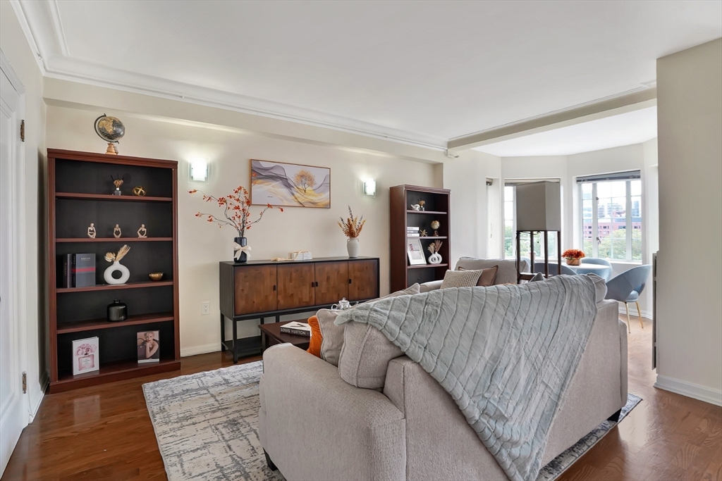 20 Chapel Street, Unit B801 Brookline, MA 02446 - Photo 6 of 27 a living room with furniture and a wooden floor