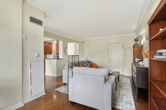 a living room with furniture and a walk in closet