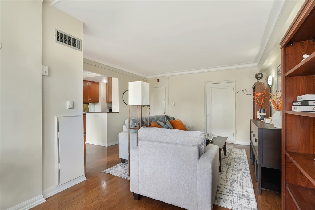 20 Chapel Street, Unit B801 Brookline, MA 02446 - Photo 9 of 27 a living room with furniture and a walk in closet