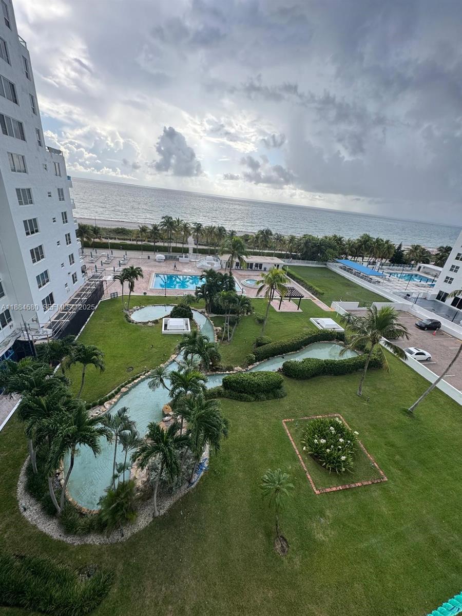 5005 Collins Avenue, Unit 714 Miami Beach, FL 33140 - Photo 26 of 36 an aerial view of a residential houses with outdoor space and lake view