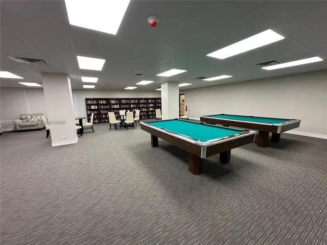 a area with pool table and furniture