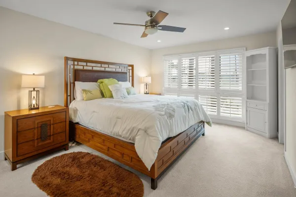 a bedroom with a bed and a dresser