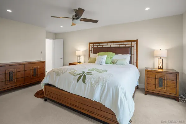 a bedroom with a bed and a cabinets