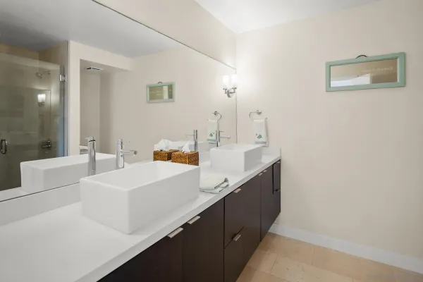 a spacious bathroom with a sink and a mirror