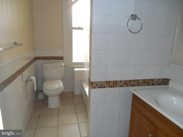 a bathroom with a toilet and a sink