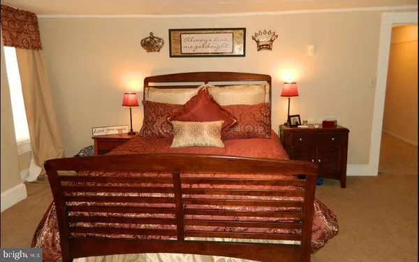 a bedroom with a bed and furniture