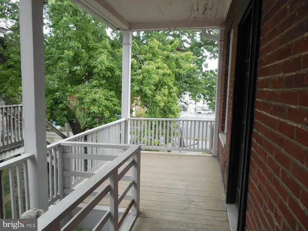 a view of balcony with wooden floor