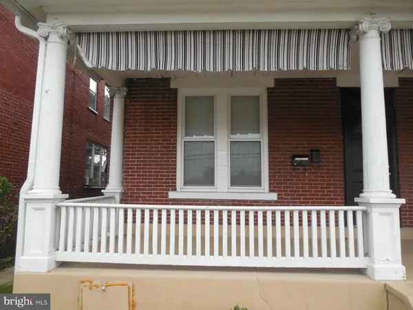 a view of a brick house with a window