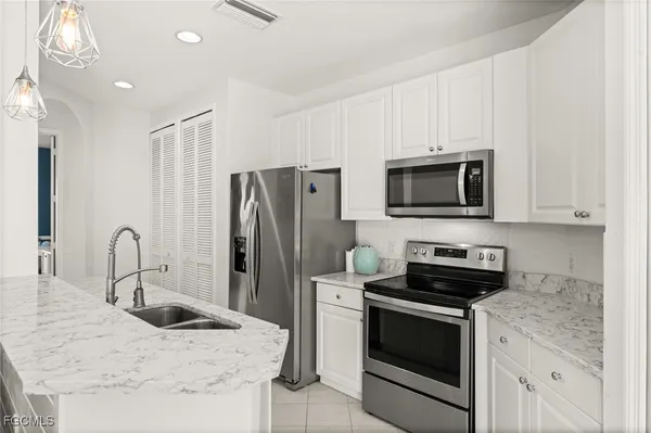 $319,900 | 1340 Sweetwater Cove, Unit 202, Naples, FL 34110