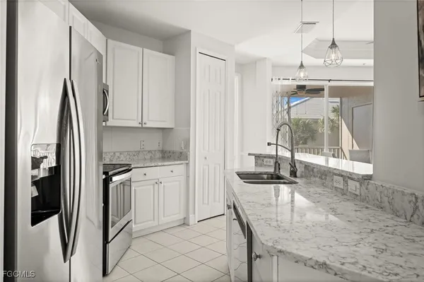 $319,900 | 1340 Sweetwater Cove, Unit 202, Naples, FL 34110