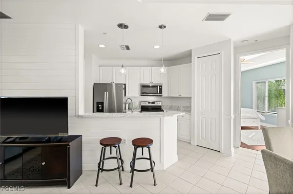 $319,900 | 1340 Sweetwater Cove, Unit 202, Naples, FL 34110