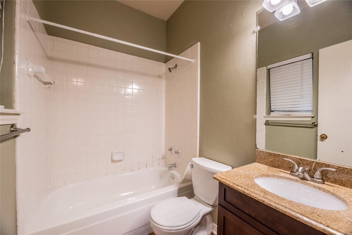 601 Nelray Boulevard, Unit 5 Austin, TX 78751 - Photo 8 of 13 Full bath featuring bathtub / shower combination, vanity, and a textured wall