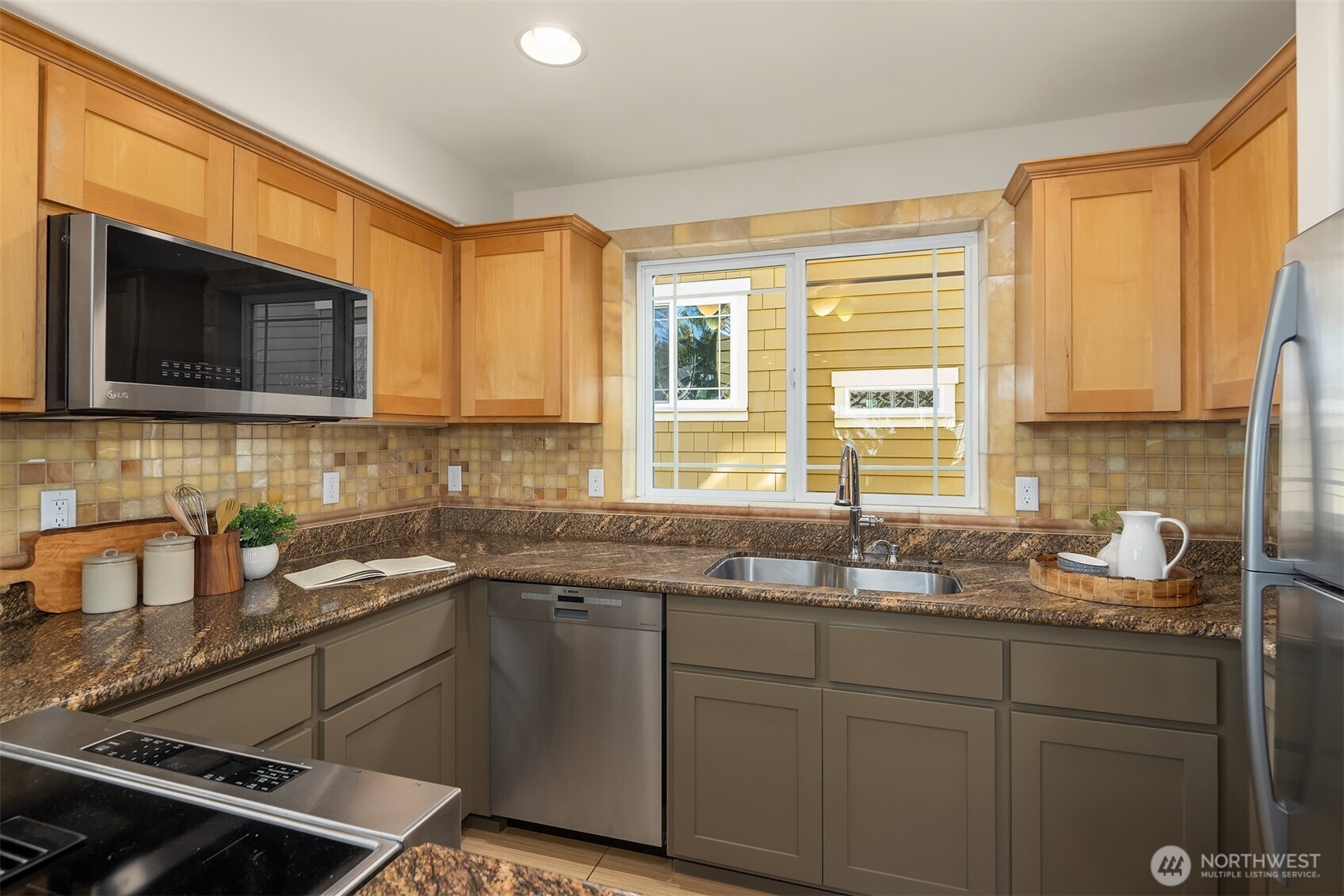 739 North 94th Street, Unit B Seattle, WA 98103 - Photo 12 of 39 a kitchen with a sink stove top oven and cabinets