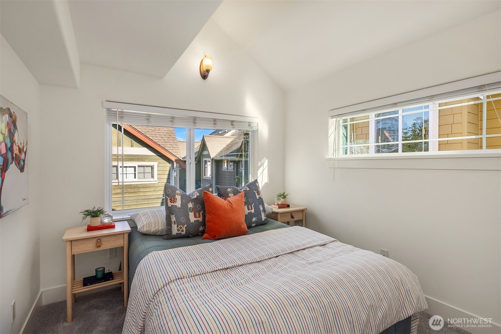 739 North 94th Street, Unit B Seattle, WA 98103 - Photo 20 of 39 a bedroom with a bed and windows