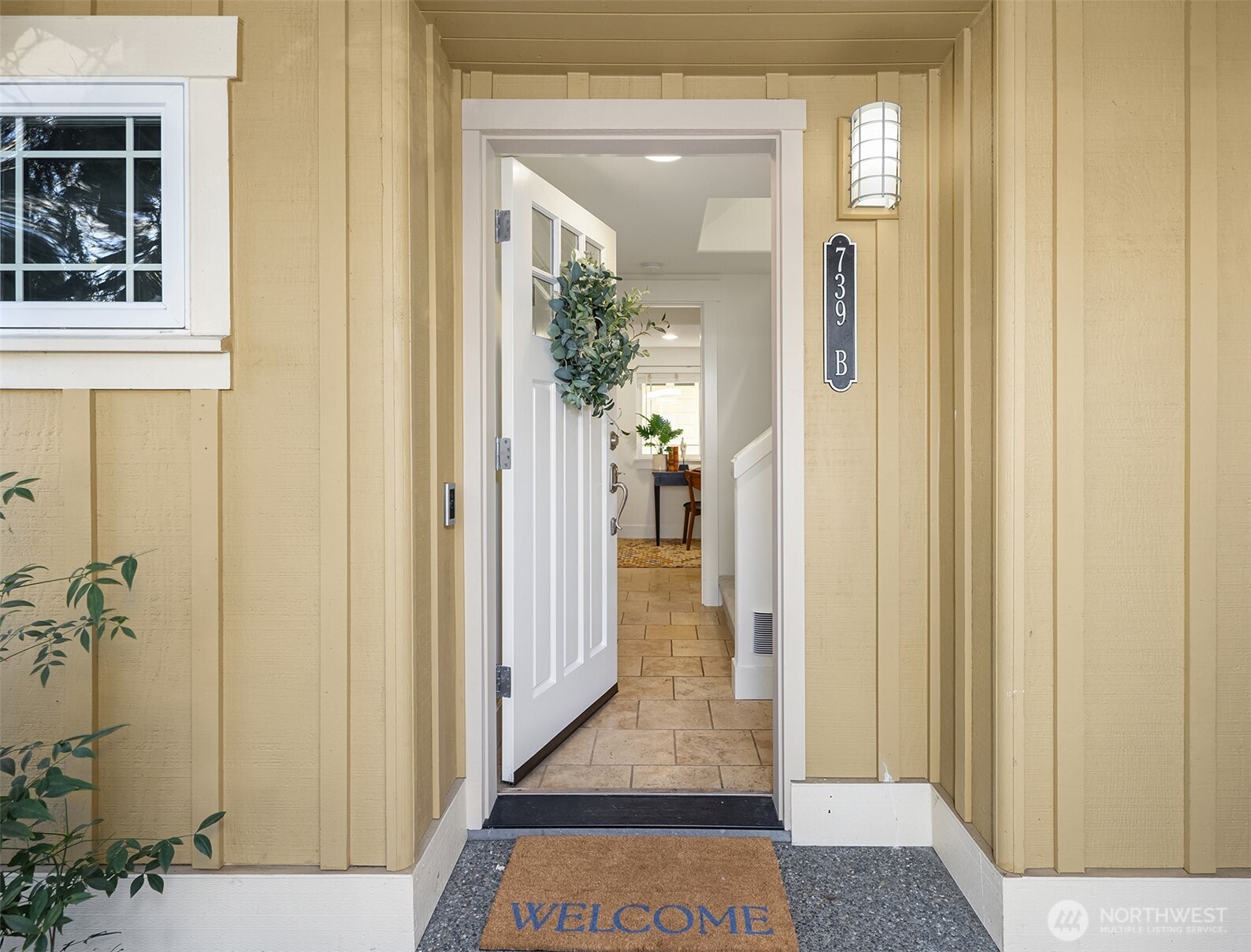 739 North 94th Street, Unit B Seattle, WA 98103 - Photo 2 of 39 a view of a hallway with a glass door and windows