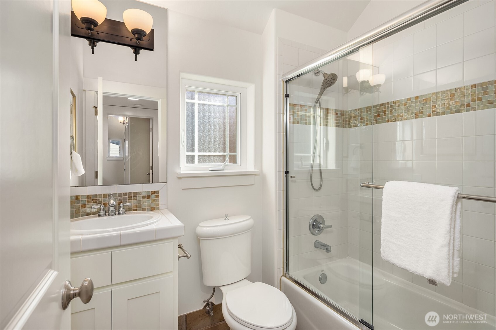 739 North 94th Street, Unit B Seattle, WA 98103 - Photo 21 of 39 a bathroom with a shower toilet and sink