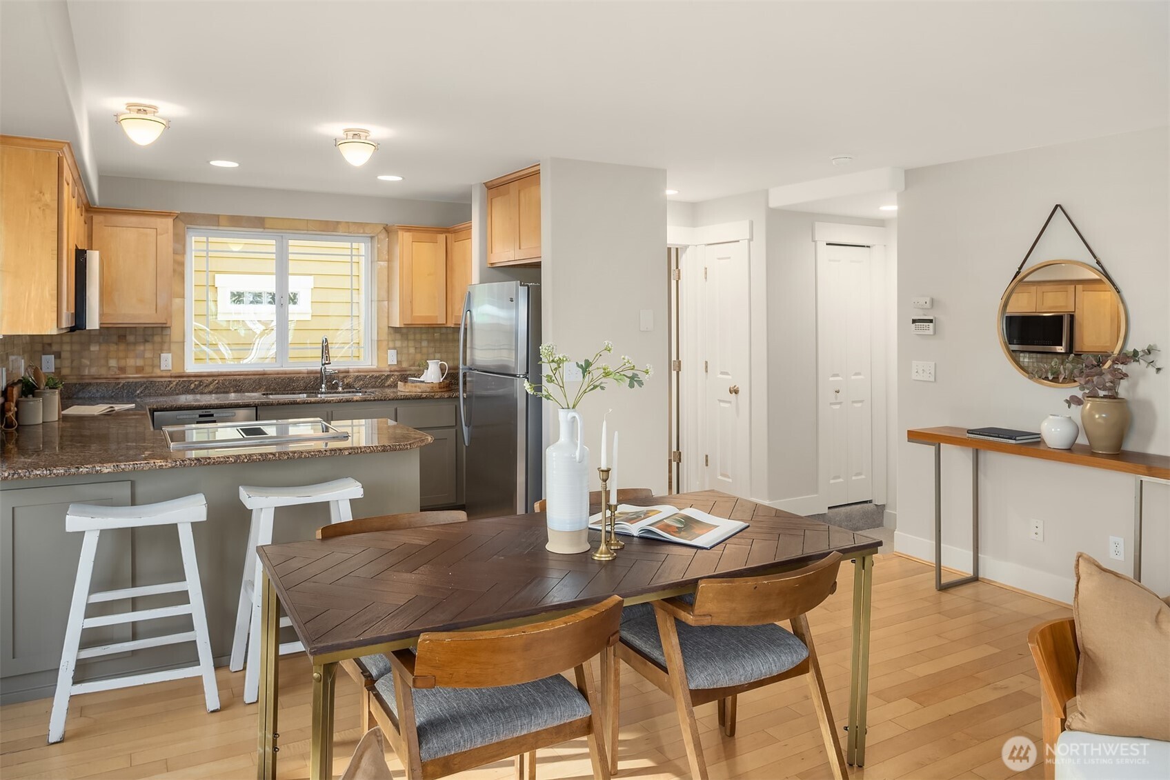 739 North 94th Street, Unit B Seattle, WA 98103 - Photo 28 of 39 a kitchen with a table and chairs in it