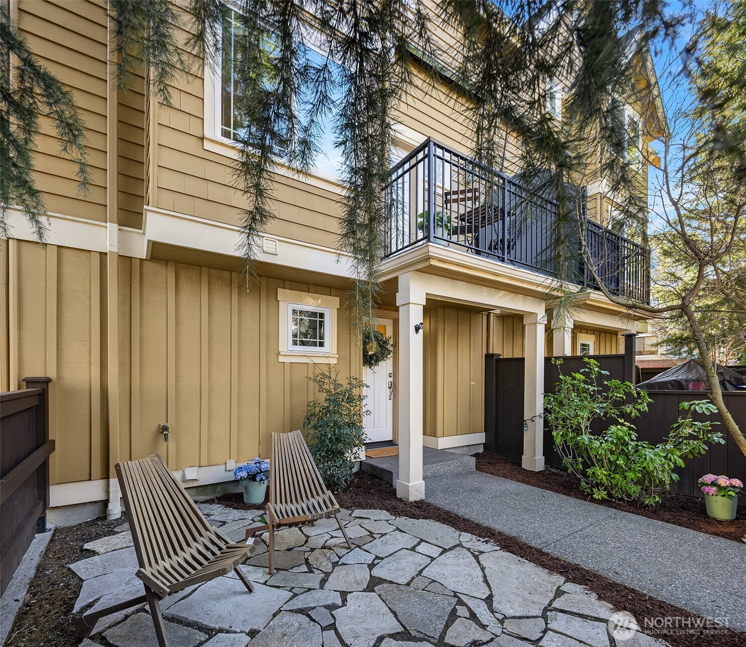 739 North 94th Street, Unit B Seattle, WA 98103 - Photo 34 of 39 a view of house with patio outdoor seating space