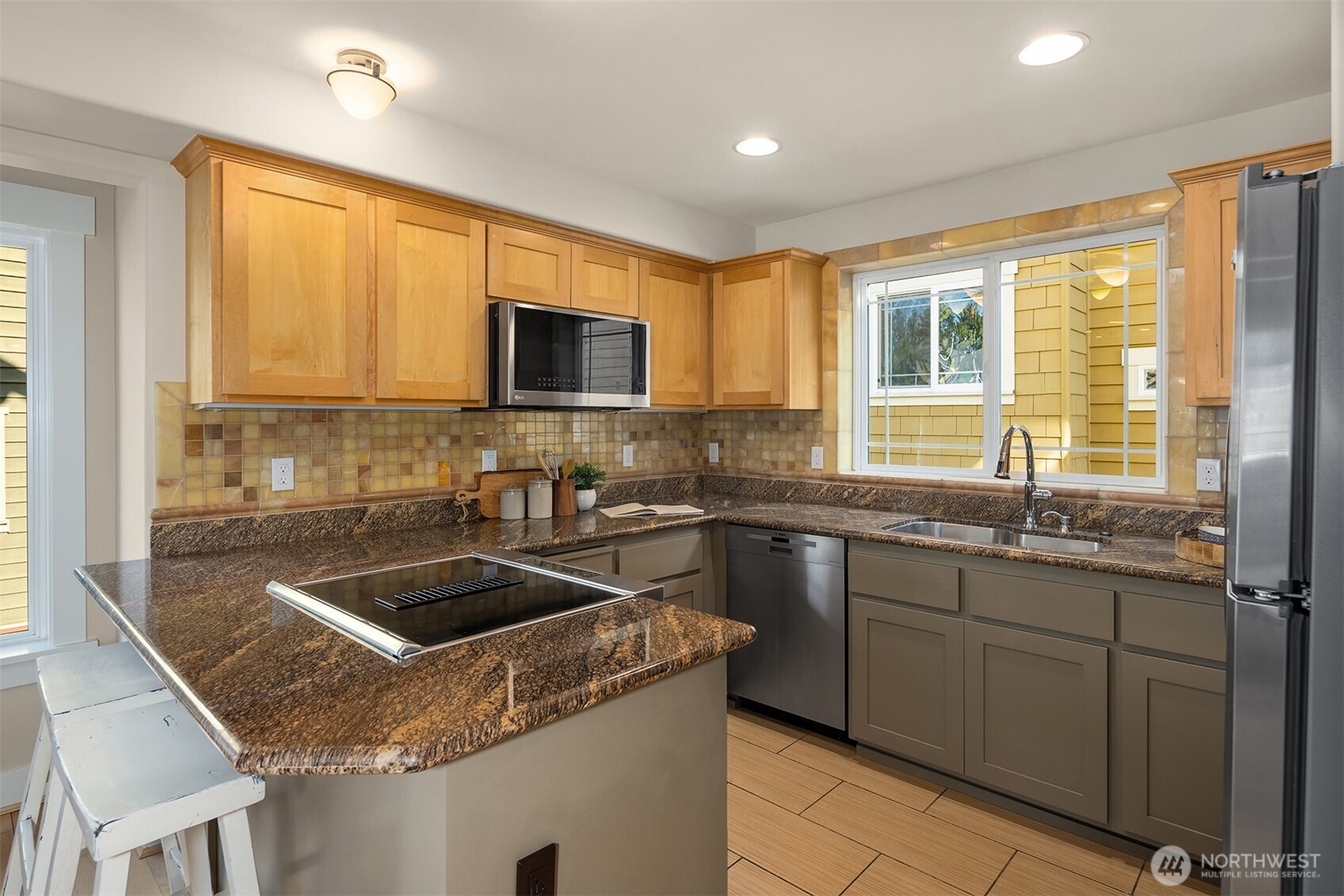 739 North 94th Street, Unit B Seattle, WA 98103 - Photo 6 of 39 a kitchen with granite countertop a sink stove and cabinets