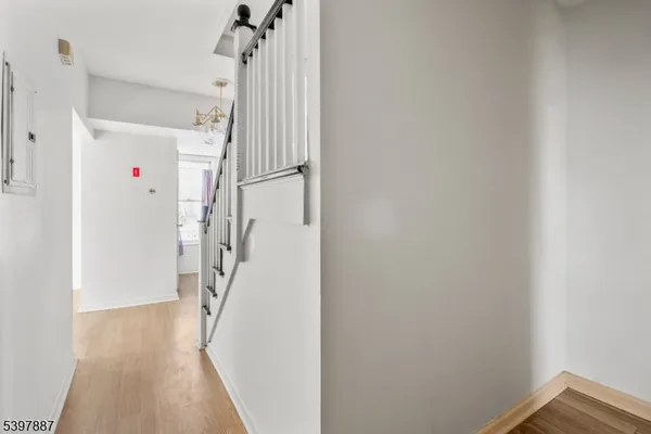 a view of a hallway view with staircase