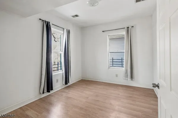 wooden floor and windows in an empty room