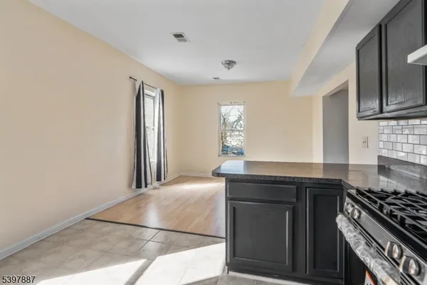a kitchen with stainless steel appliances granite countertop a stove and a sink