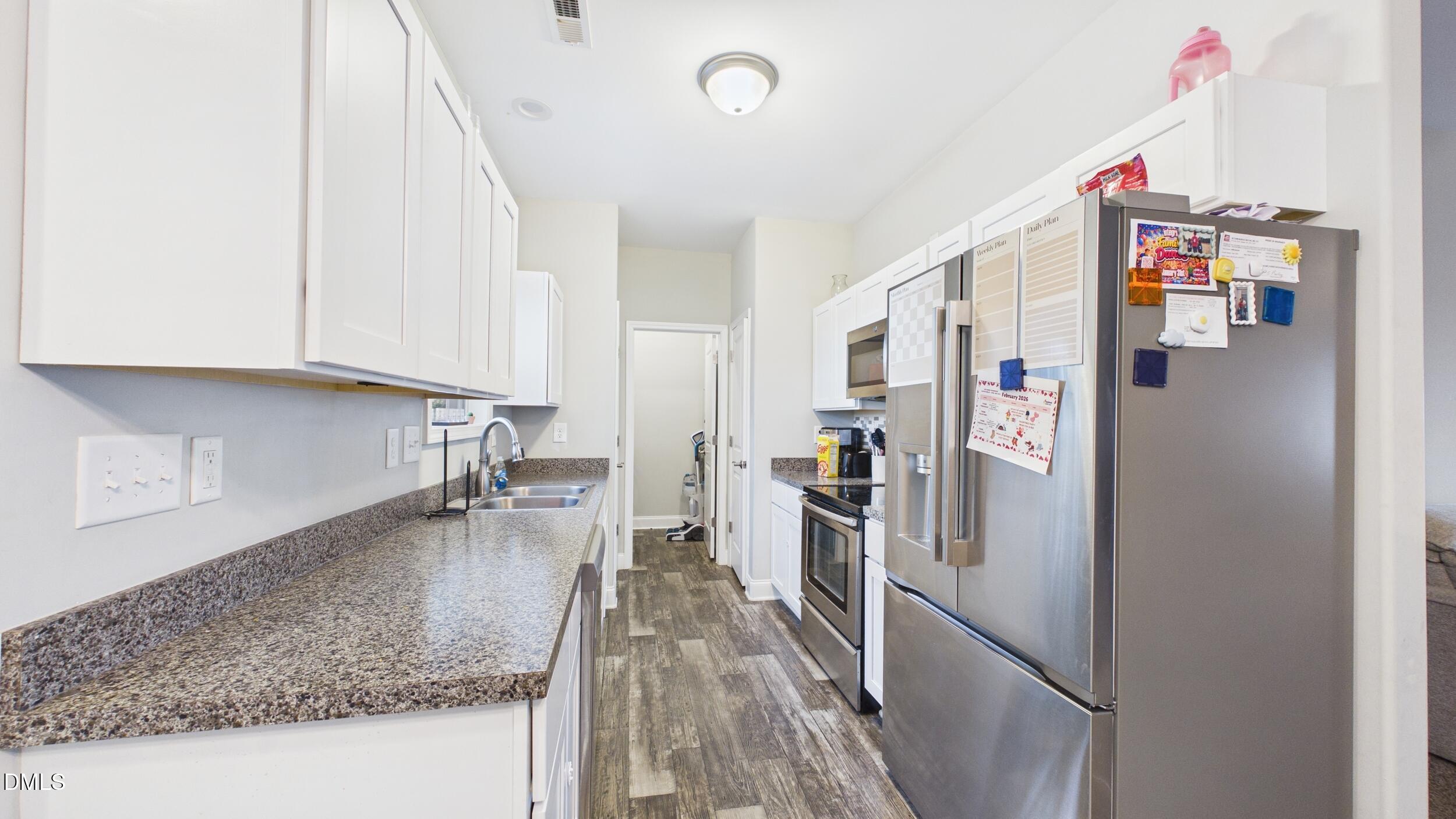 5930 Old 421 Road Liberty, NC 27298 - Photo 11 of 42 a kitchen with refrigerator and window