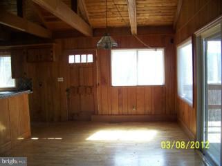 307 Farm Ridge Road Front Royal, VA 22630 - Photo 3 of 19 a view of a room with wooden walls