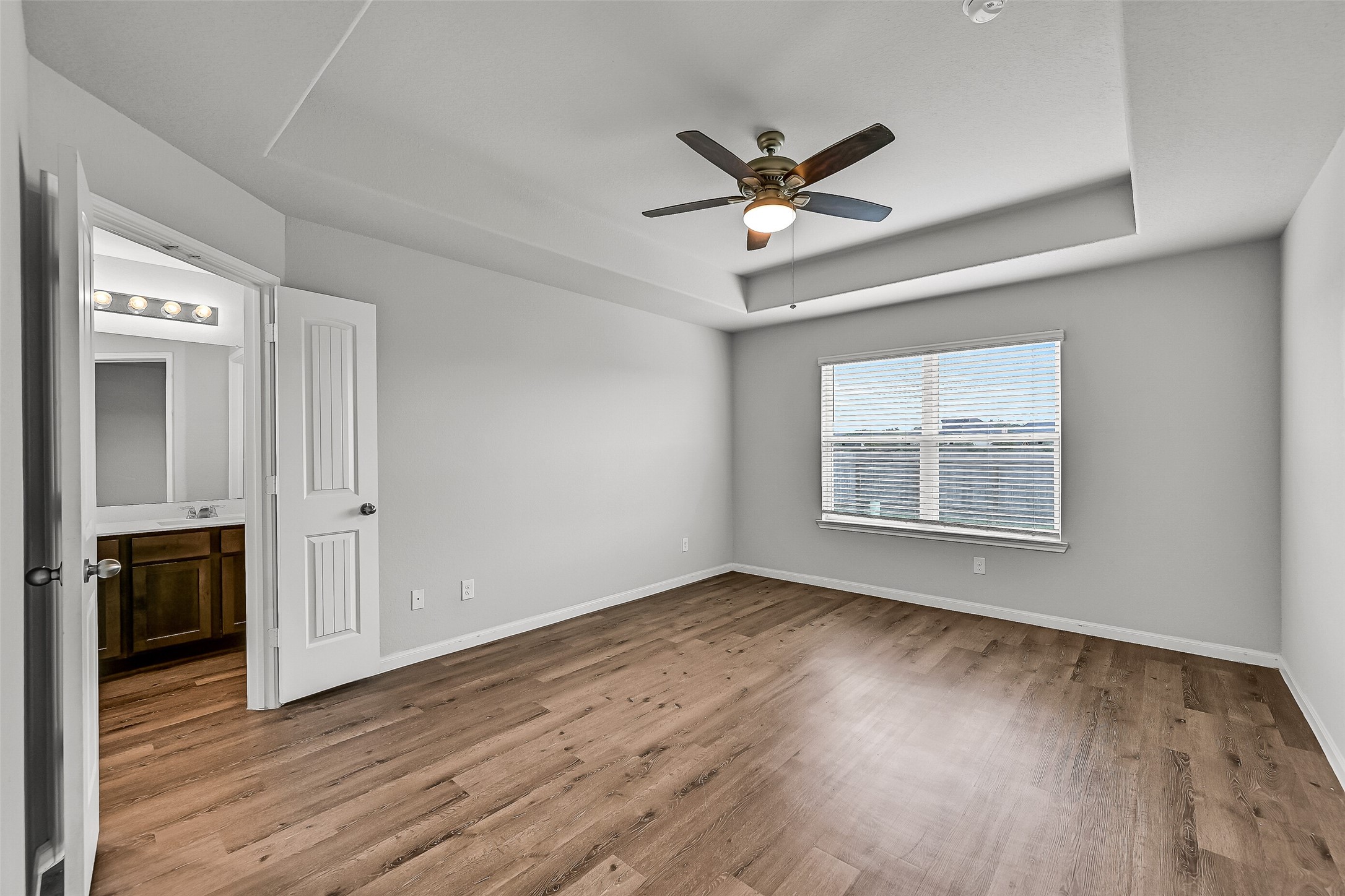 5407 James Michael Drive Rosharon, TX 77583 - Photo 13 of 32 a view of an empty room with wooden floor and a window