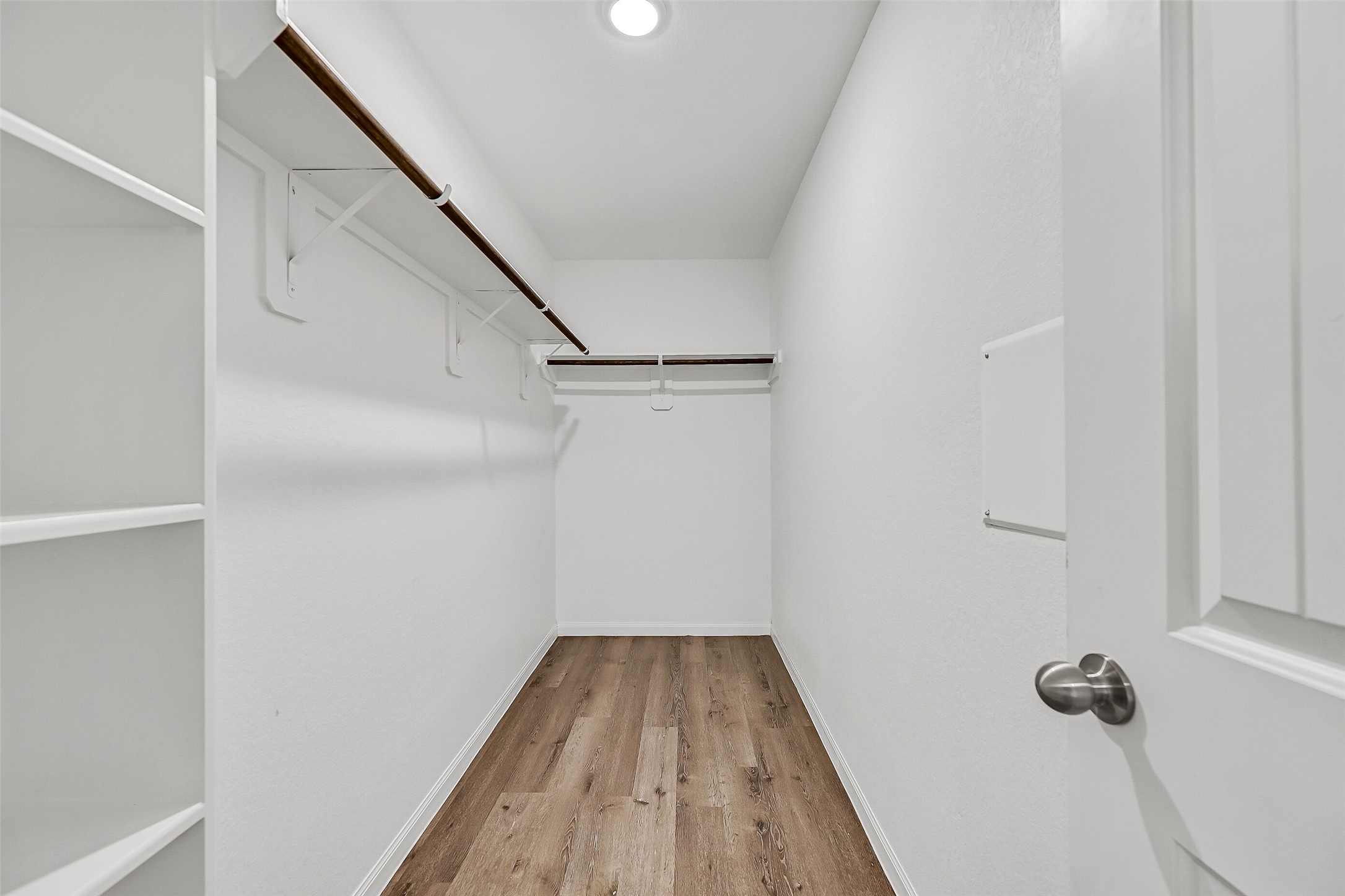 5407 James Michael Drive Rosharon, TX 77583 - Photo 17 of 32 a view of a room with wooden floor and staircase