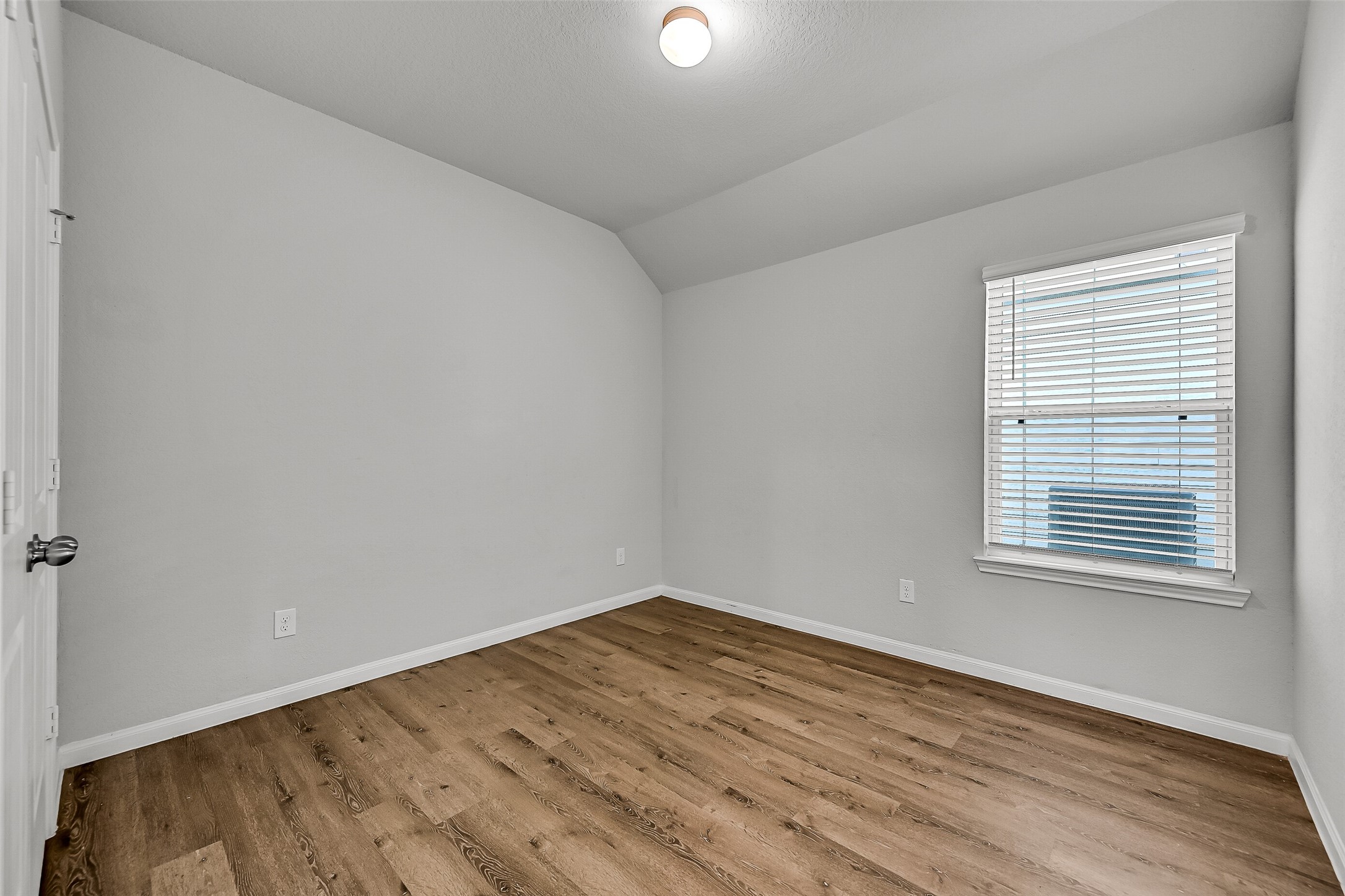 5407 James Michael Drive Rosharon, TX 77583 - Photo 18 of 32 an empty room with wooden floor and windows