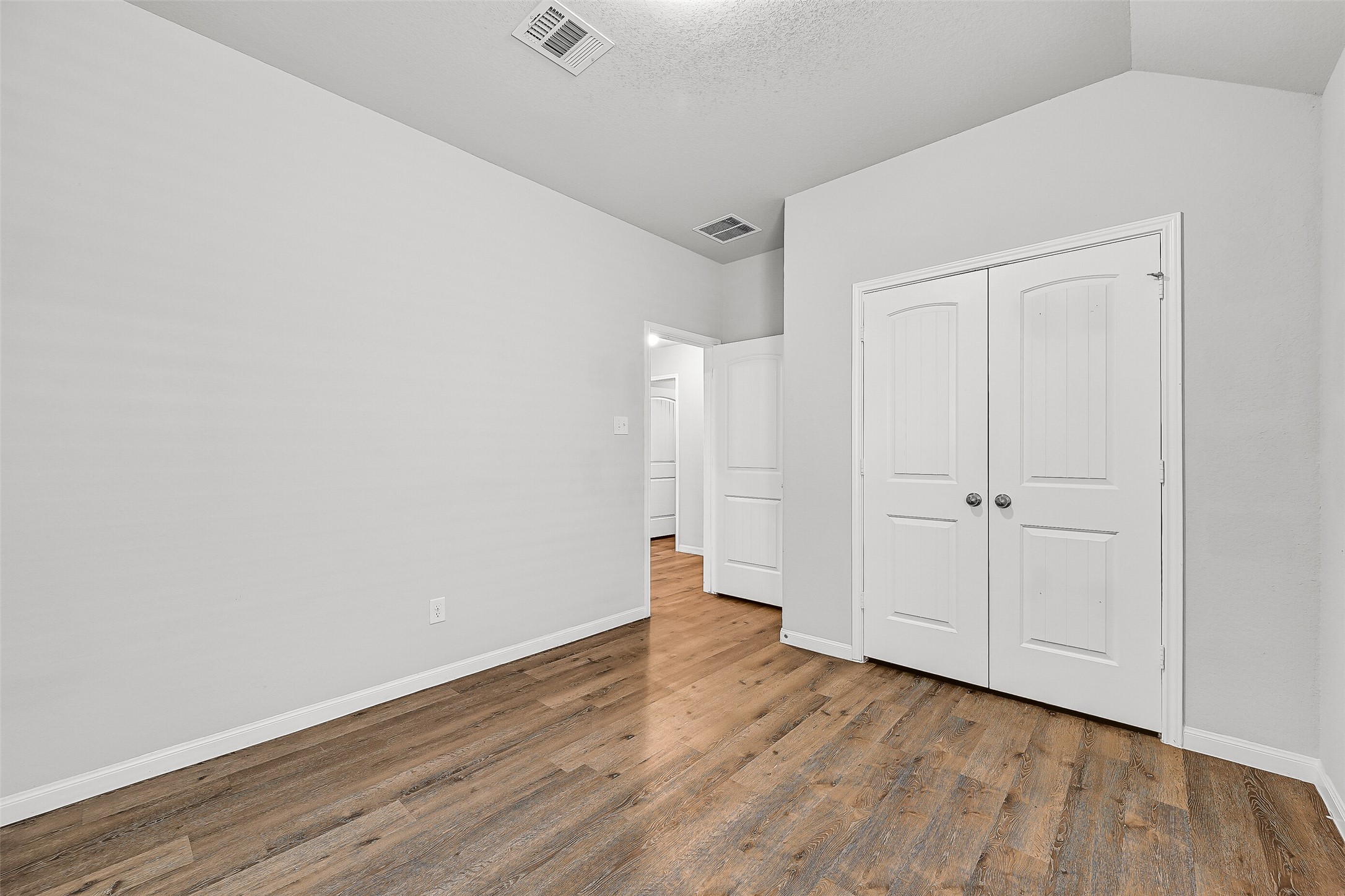 5407 James Michael Drive Rosharon, TX 77583 - Photo 21 of 32 a view of an empty room with wooden floor