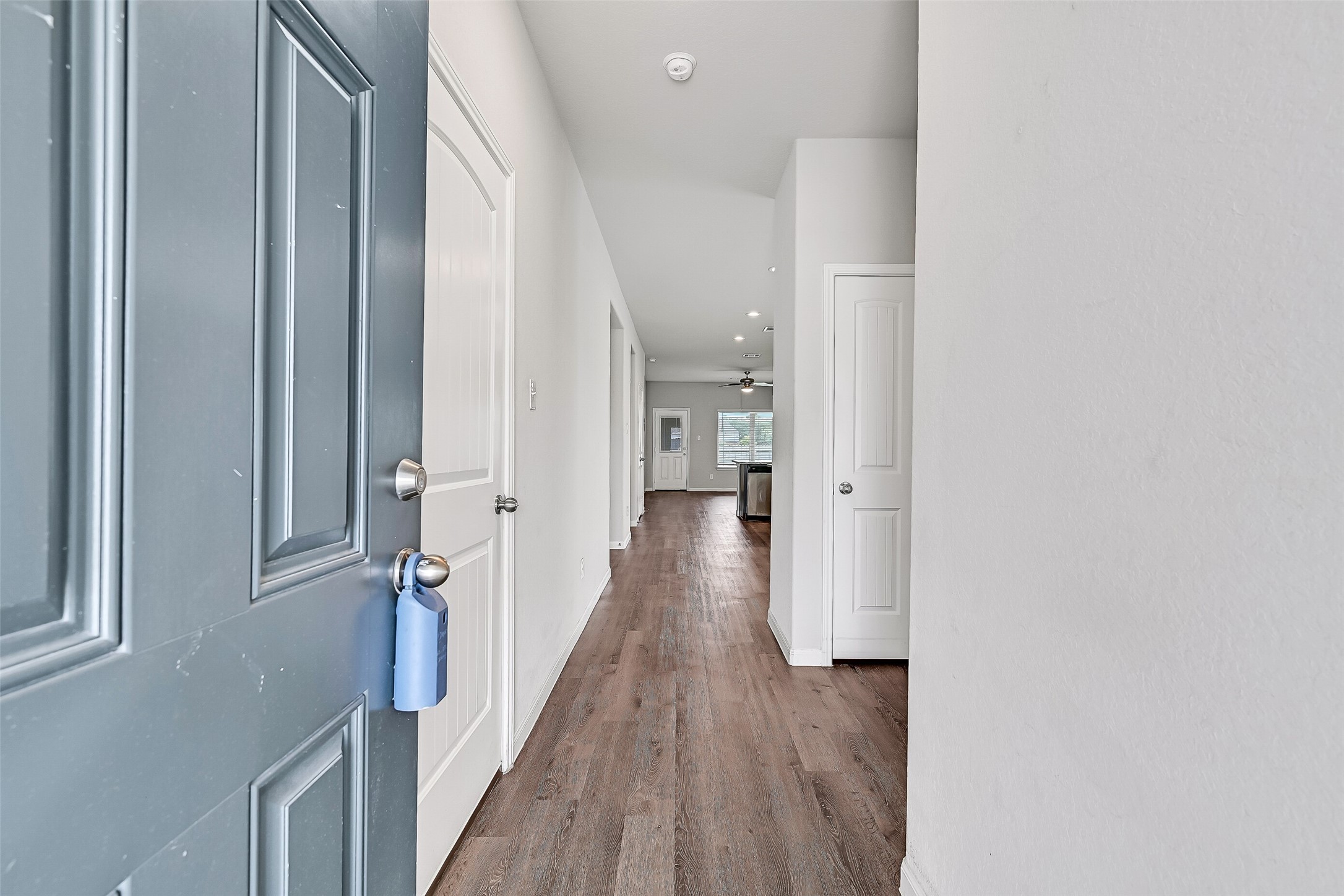 5407 James Michael Drive Rosharon, TX 77583 - Photo 5 of 32 a view of a hallway with wooden floor and staircase