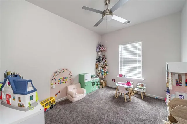 a room with furniture and a book shelf