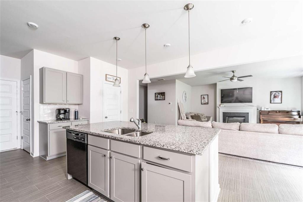 84 Royal Oaks Drive Rome, GA 30165 - Photo 8 of 27 a kitchen with stainless steel appliances granite countertop a sink a stove and a refrigerator